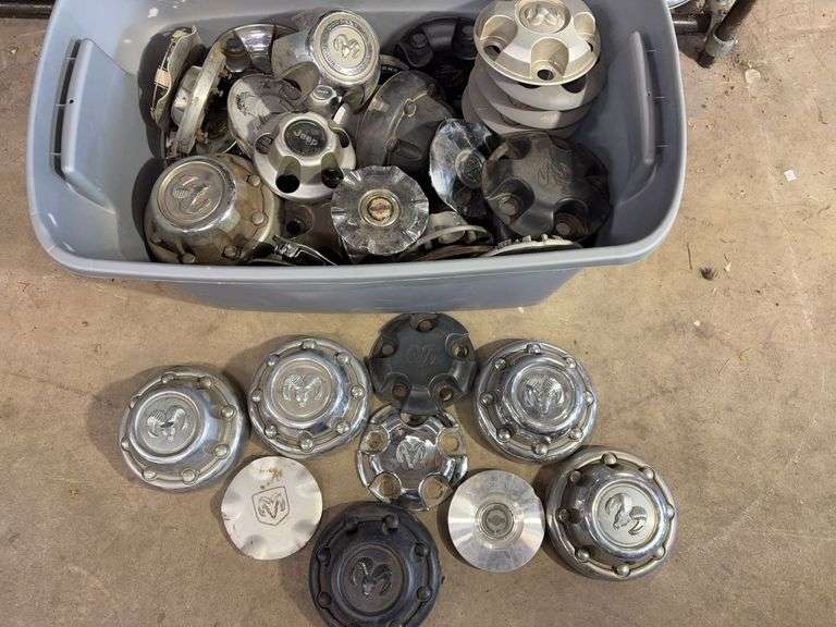 Large tote of hub caps and parts - Mostly Ram -see photos