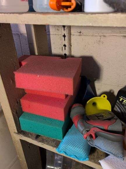 Shelf of glass cleaner, other cleaners, and other vehicle fluids