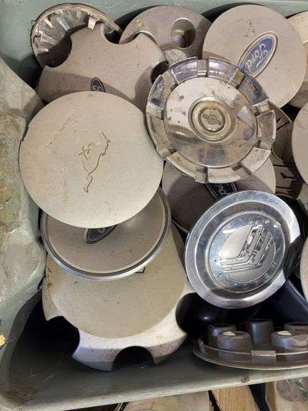 Large lot of miscellaneous hub caps and parts, paste wax and more