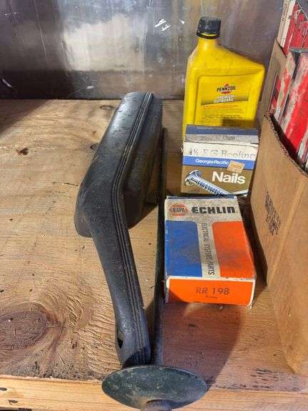 (2) shelves of vehicle-related items - sparkplugs, signs, and more