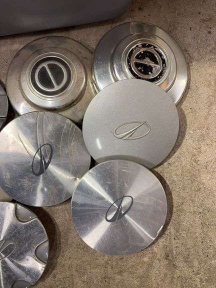 Tote of Miscellaneous hub caps and parts - Buick, Oldsmobile and more - see photos