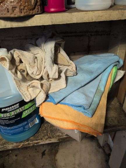 Shelf of shop rags and vehicle fluids