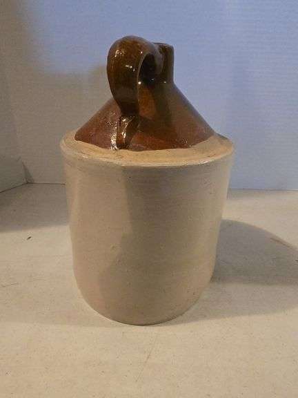 BROWN TOP 1 GALLON CROCK JUG HAS HAIRLINE ON BOTTOM