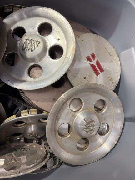 Tote of Oldsmobile hub caps and covers