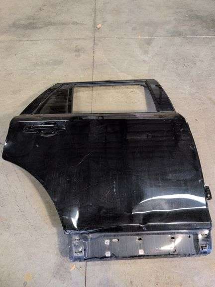 Unmarked black vehicle door - see photos