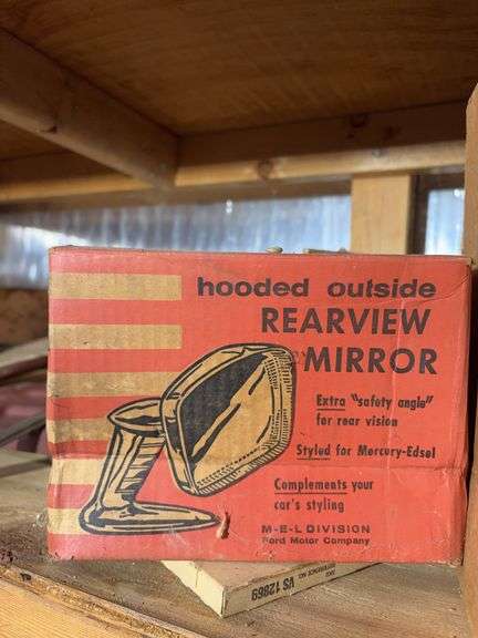 Shelf of miscellaneous car parts and other items