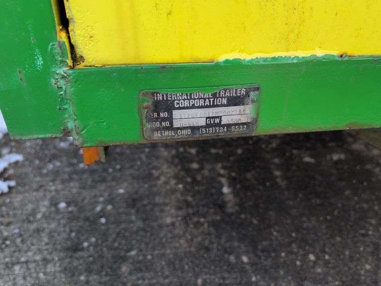 Open green and yellow trailer - 8' x 5' bed - 2" ball hitch - flat tire