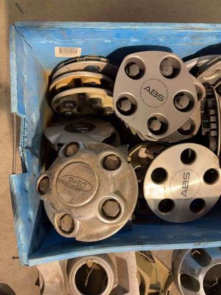 Tote of miscellaneous hubcaps/center caps - Chevy, Toyota, and more