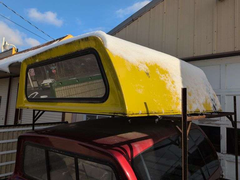 Yellow truckbed cap for a Dodge - 6' wide, 79" long