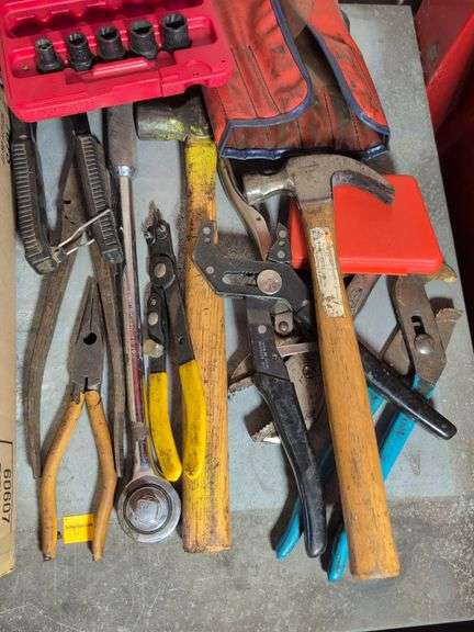 Large assortment of tools - pliers, hammer, wrench, and more
