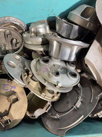 Large tote of hub caps and parts -Honda, Mazda, Nissan and more
