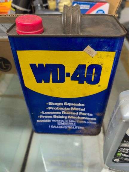 Flat of WD-40, oil, and other mechanic fluids