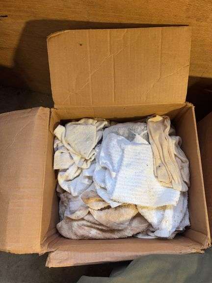 Boxes of rags, military bag, and blankets