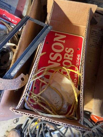 (2) shelves of vehicle-related items - sparkplugs, signs, and more