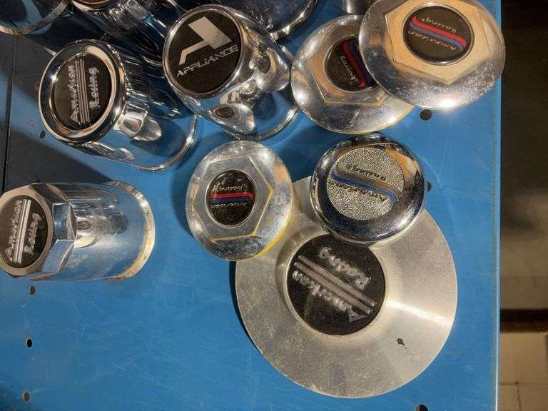 Box of American racing hubcap covers