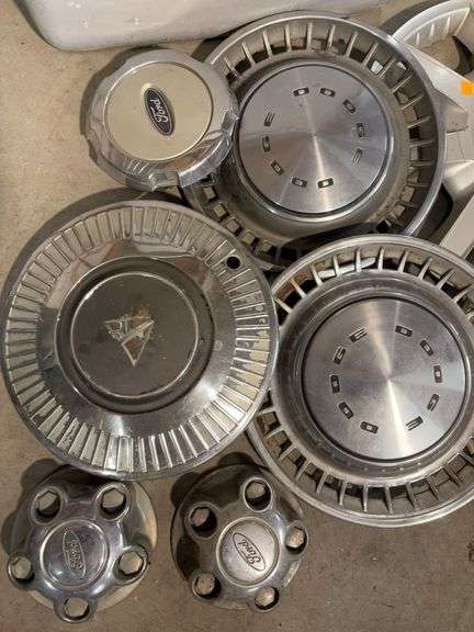 Tote of miscellaneous hubcaps - Buick, Honda, and more