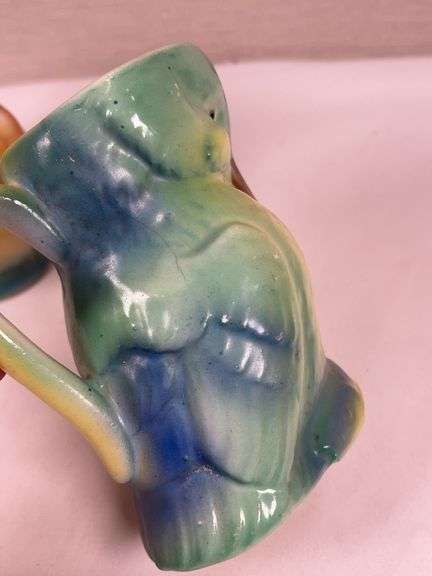 PAIR OF UNUSUAL POTTERY MUGS