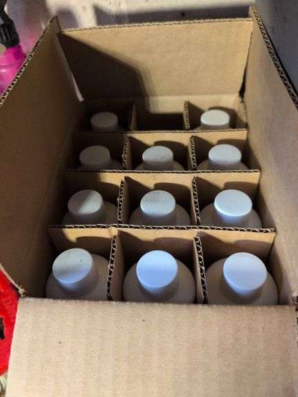 Shelf of glass cleaner, other cleaners, and other vehicle fluids