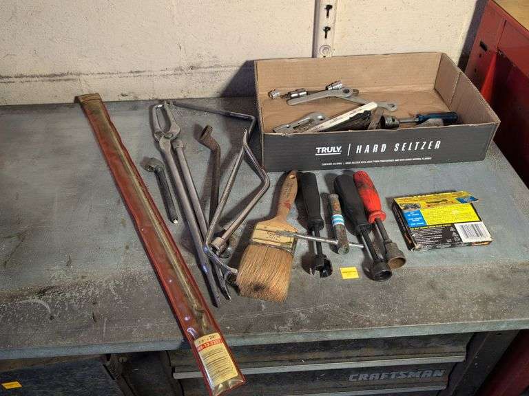 Flat of tools - staples, wrench, and more