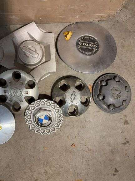 Large tote of miscellaneous hub caps and parts -Volvo, Nissan, Honda, BMW and more