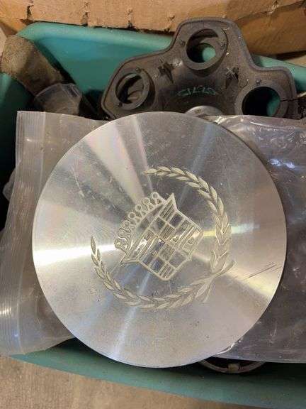 Assortment of hub caps including Jeep, Buick, and Chevy -see photos