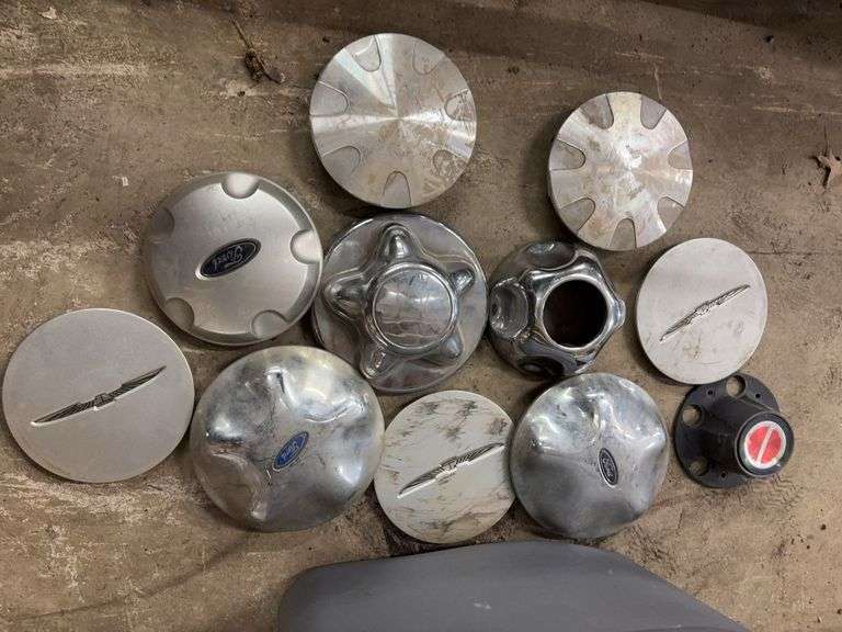 Tote of Miscellaneous hub caps and parts -see photos