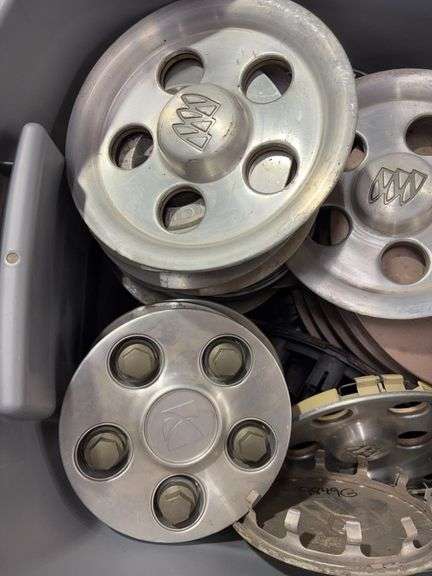 Tote of Oldsmobile hub caps and covers