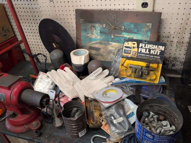 Assortment of items - tape, nuts and bolts, gloves, and more
