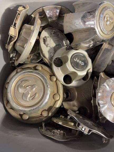 Large tote of hub caps and parts - Mostly Ram -see photos