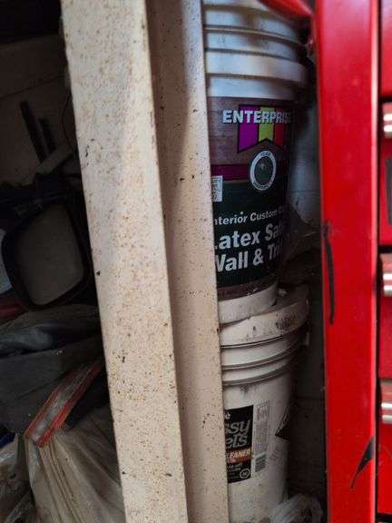 Contents of corner - car parts, center caps, and more