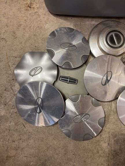 Tote of Miscellaneous hub caps and parts - Buick, Oldsmobile and more - see photos