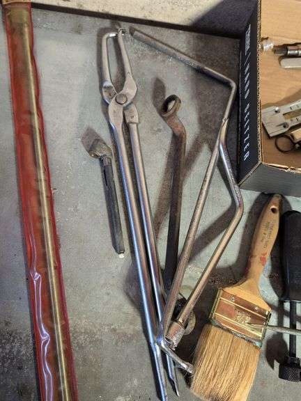 Flat of tools - staples, wrench, and more