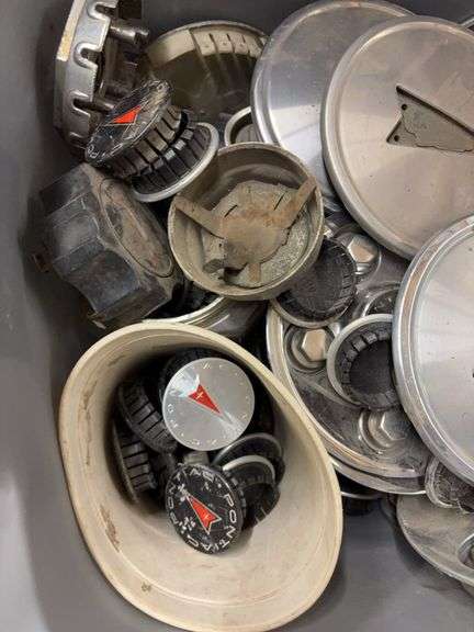 Tote of Pontiac hub caps and parts