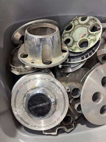 Tote of miscellaneous hub caps and parts -Limited, Chevy and more -see photos