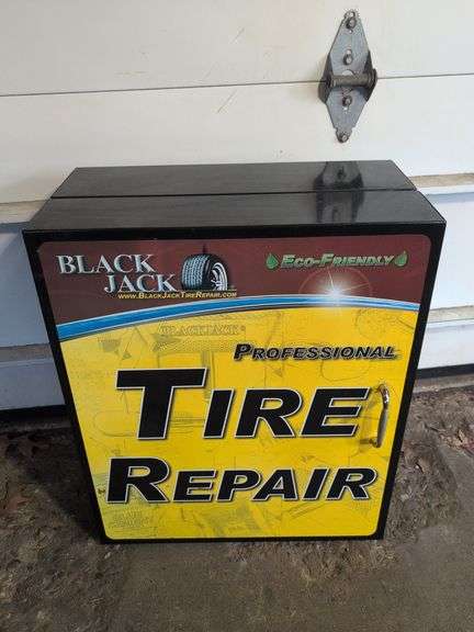 Metal tire repair cabinet with contents