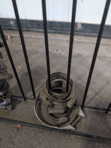 NAPA metal rack with hose clamps