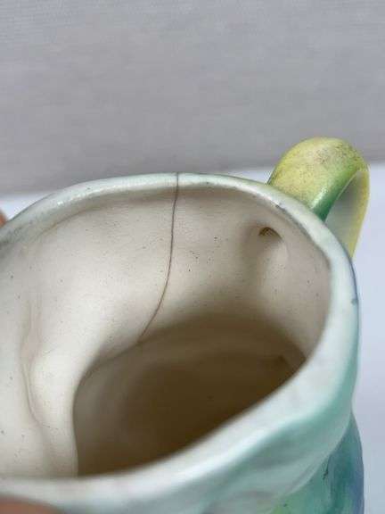 PAIR OF UNUSUAL POTTERY MUGS