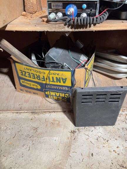 Contents of cabinet - oil filters, wiper blades, CB radios, manuals, and more