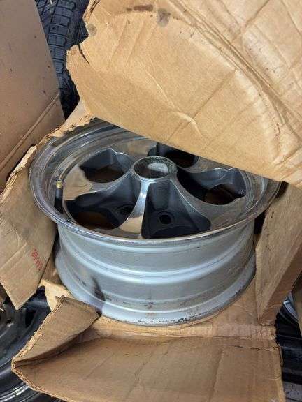 (2) wheel rims in boxes - see photos