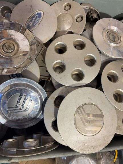 Large lot of miscellaneous hub caps and parts, paste wax and more