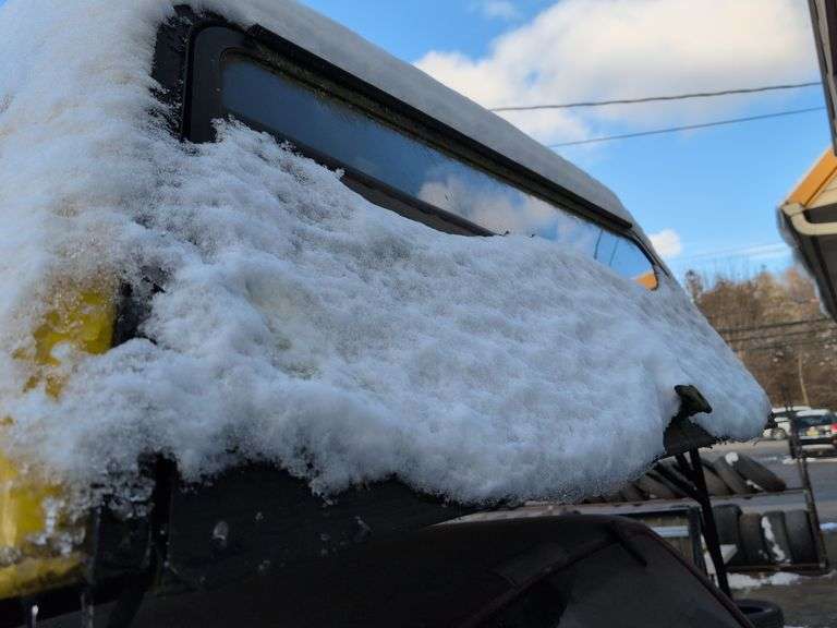 Yellow truckbed cap for a Dodge - 6' wide, 79" long