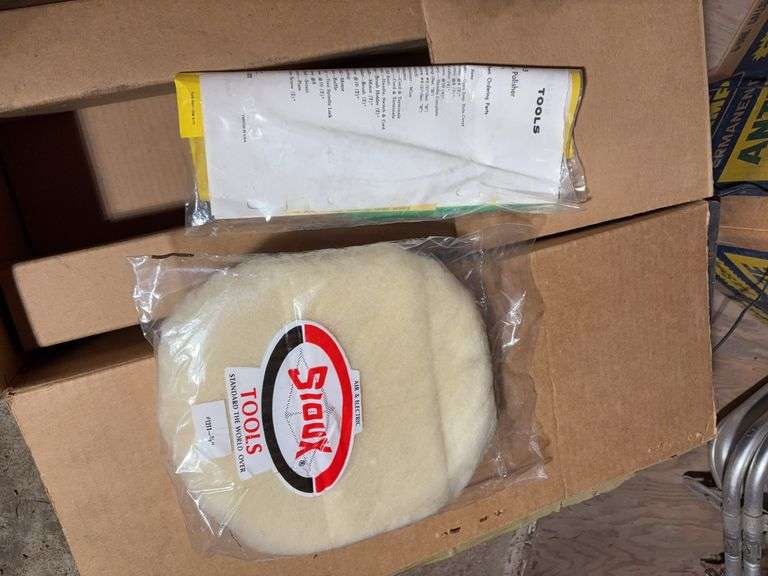 Contents of cabinet - oil filters, wiper blades, CB radios, manuals, and more