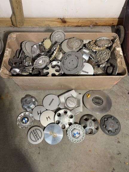 Large tote of miscellaneous hub caps and parts -Volvo, Nissan, Honda, BMW and more