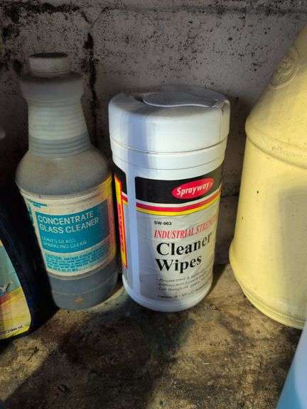 Shelf of shop rags and vehicle fluids