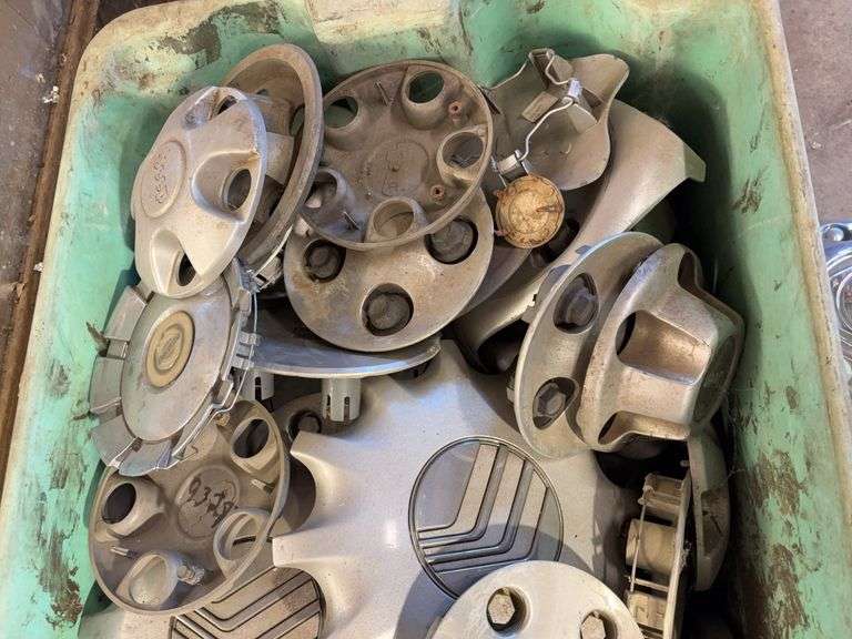 Large tote of miscellaneous hub caps and parts -Jeep, Lincoln, Ford and more