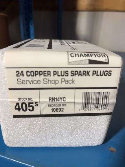(4) Champion boxes of 24 copper plus spark plugs