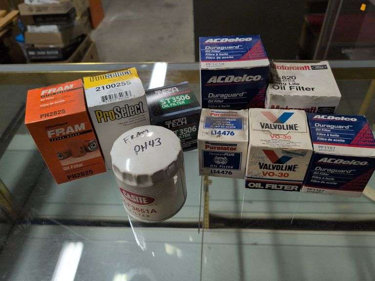Assortment of oil filters in boxes - see photos