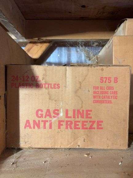 Shelf of miscellaneous car parts and other items