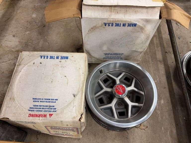 (2) 14” Pontiac wheel rims in boxes