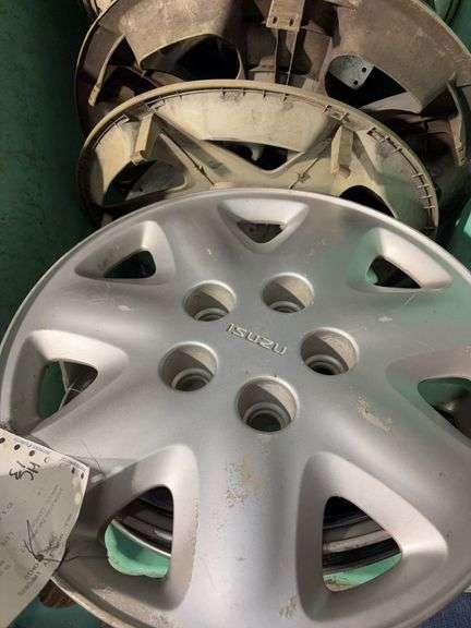 Large tote of hub caps and parts -Hyundai, Eagle and more